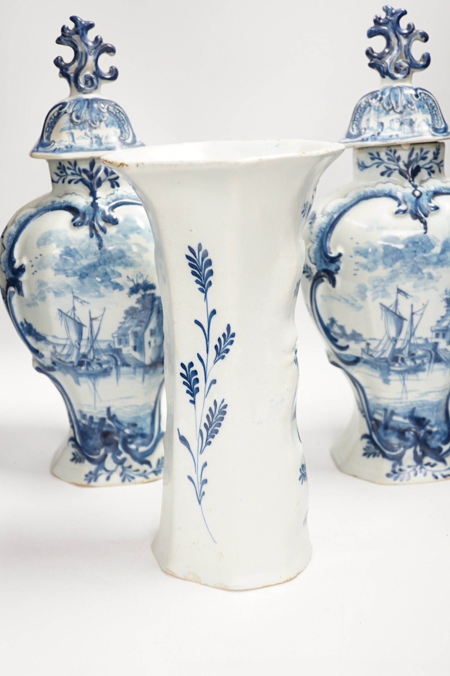 A Delft garniture of three vases, c.1770, tallest 41cm high